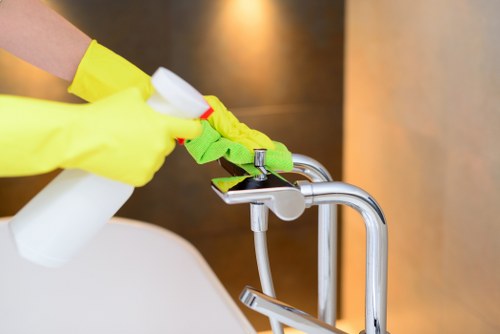 Carpet cleaning technician preparing equipment with safety precautions